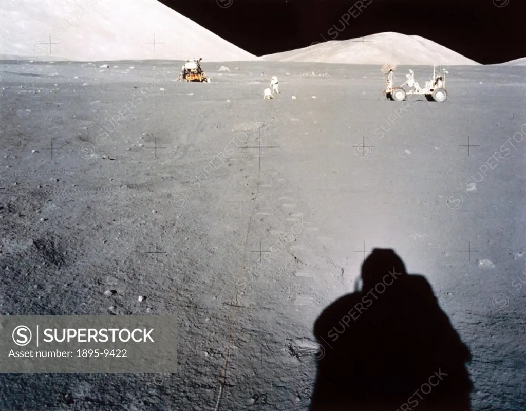 This view shows the Apollo 17 Lunar Module, Lunar Rover and an astronaut laying out experiments on the Moon´s surface. Apollo 17, the sixth and last m...