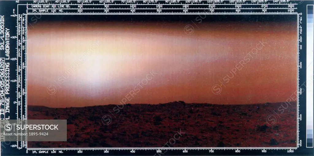 The image shows a red rock-strewn terrain with a pink sky. Two Viking spacecraft were launched towards Mars in 1975, each carrying a lander spacecraft...