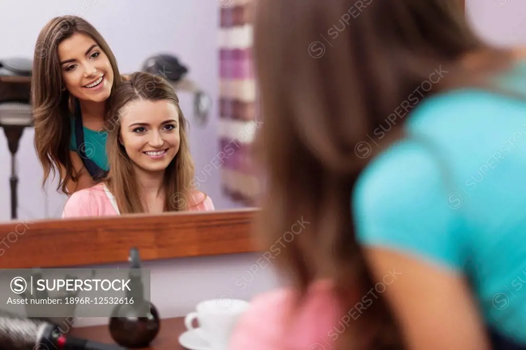 Hairdresser and customer talking in hair salon. Debica, Poland