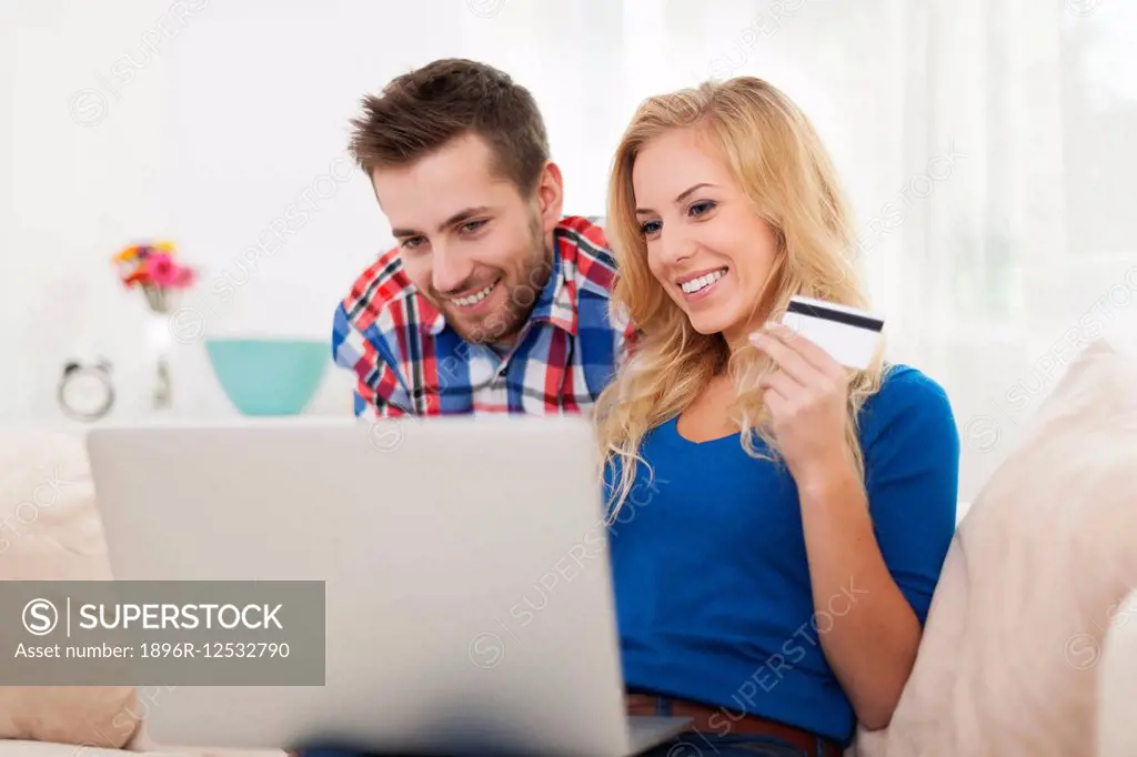 Smiling couple during the shopping online Debica, Poland.