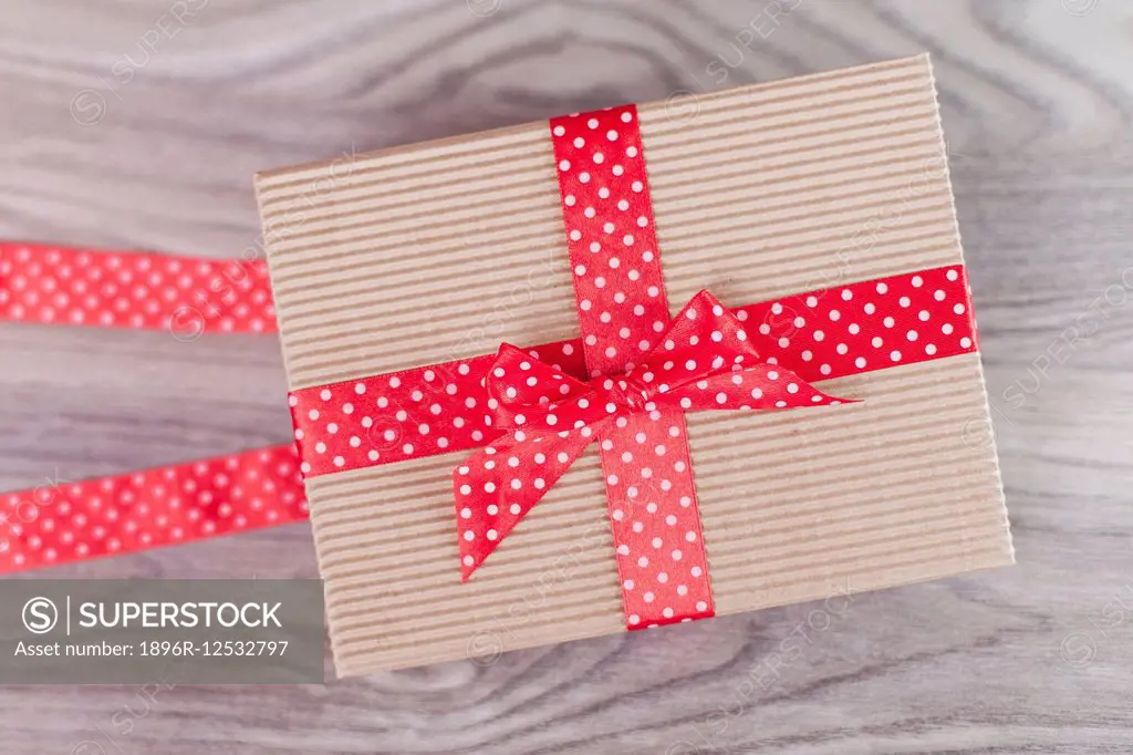 Wrapped gift box on wood Debica, Poland.