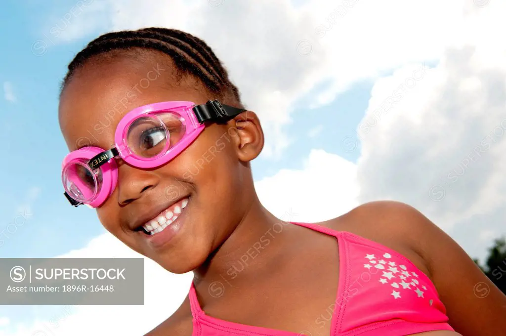 Girl wearing goggles and bikini outdoors, Johannesburg, Gauteng Province, South Africa