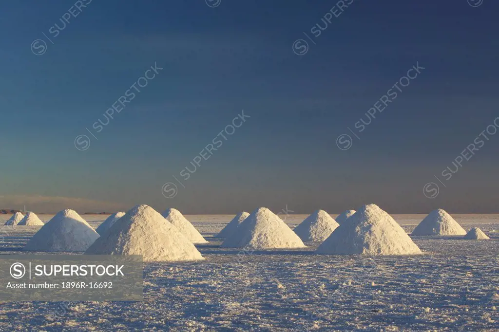 Conical heaps of excavated salt near Colchani, Salar de Uyuni, Bolivia, South America