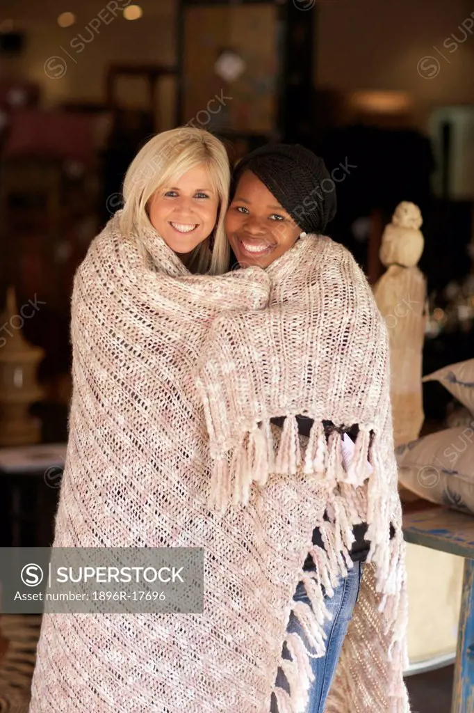 Two young women wrapped up in a blanket, Pietermaritzburg, KwaZulu_Natal, South Africa
