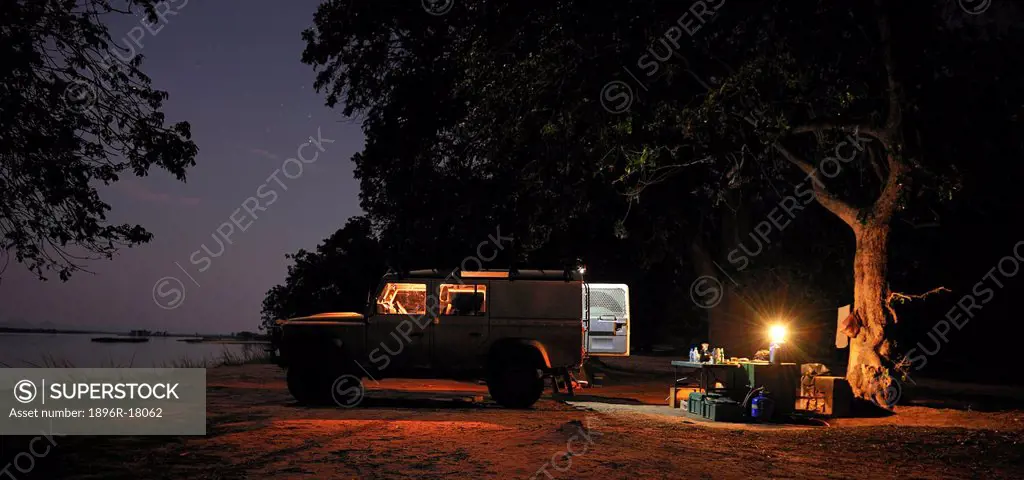 Off_road car and evening campsite alongside the Zambezi River, Mana Pools, Zambezi Valley, Zimbabwe