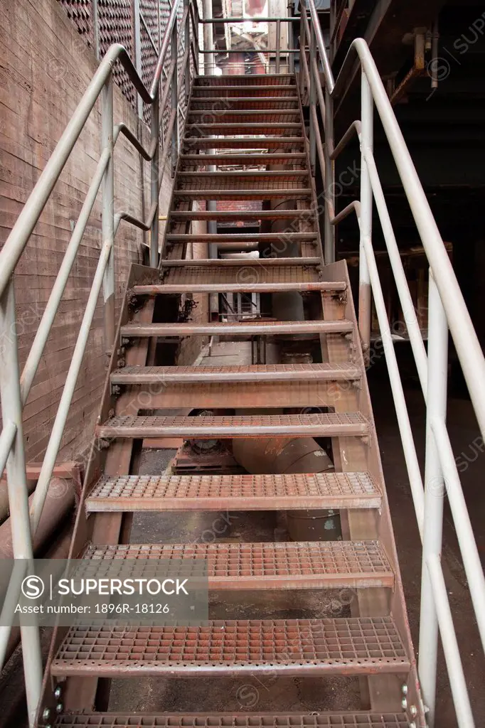 A flight of steel stairs going upwards.