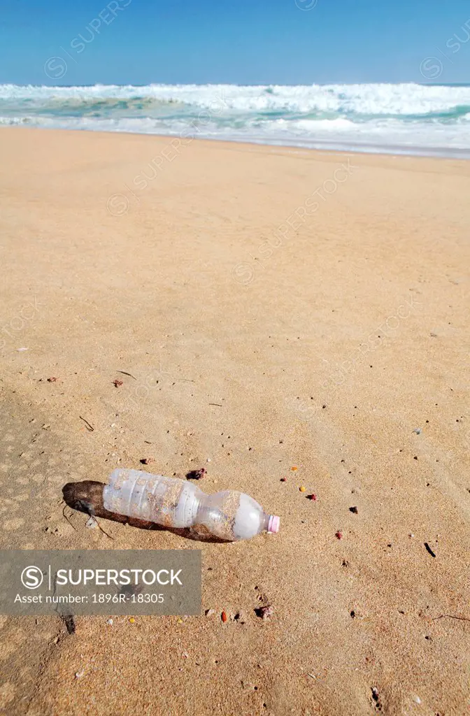 Plastic bottle left on beach, Kleinkrantz Beach, Western Cape, South Africa