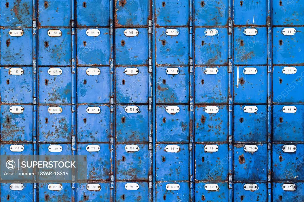 Close up image of rows of blue post boxes in Port Elizabeth, Eastern Cape, South Africa