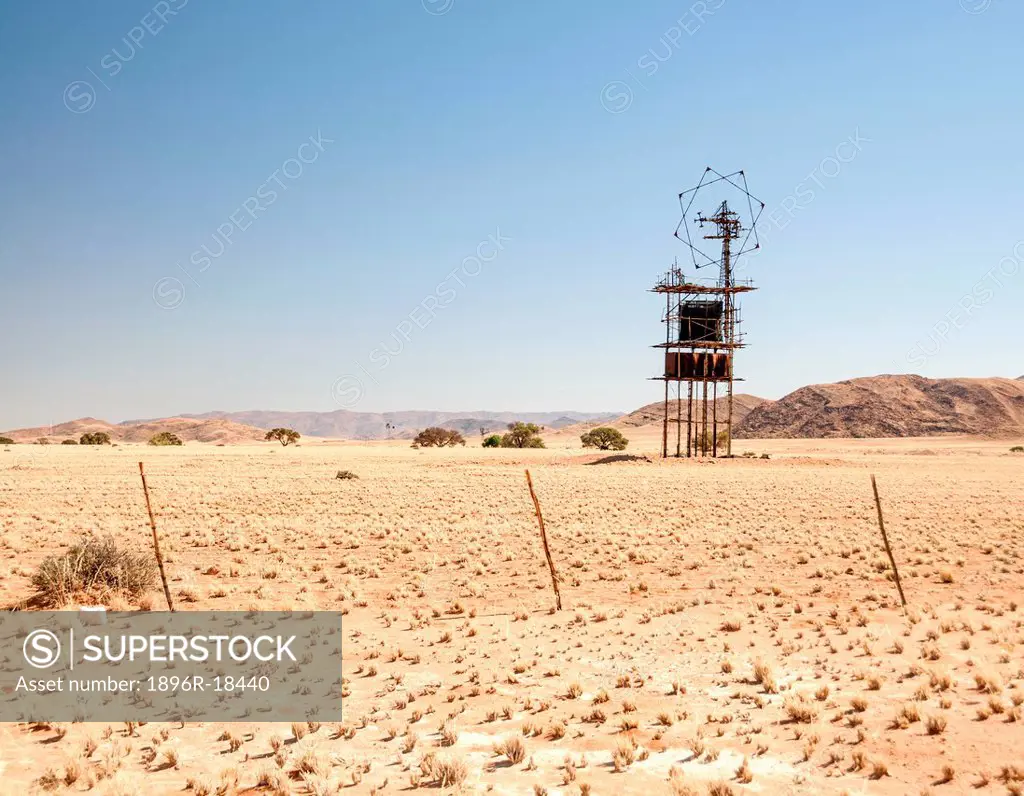 Aerial antenna and elevated water tank in desert, near Sesreim, Namib Desert, Karas Region, Namibia
