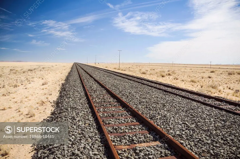 Railway track leading through desert, Kolmanskop, Luderitz, Karas Region, Namibia