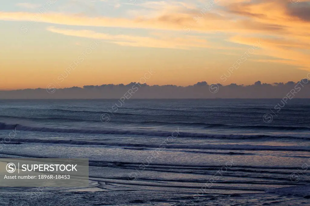 View of sea and clouds on the horizon at sunrise in Port St John´s, Wild Coast, Eastern Cape, South Africa