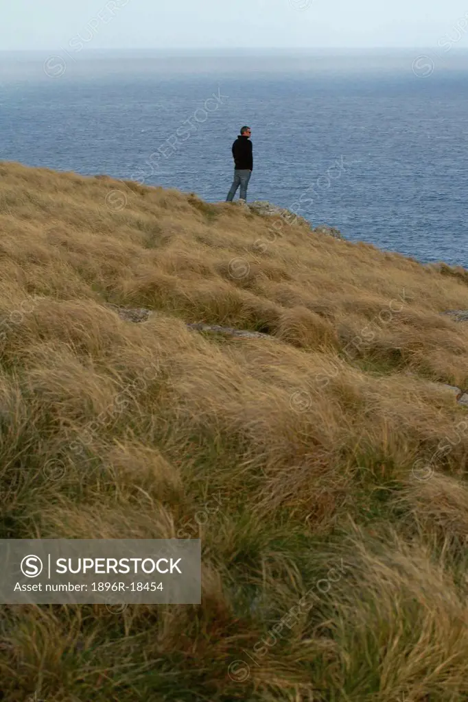 Man standing looking out to sea in Port St John´s, Wild Coast, Eastern Cape, South Africa