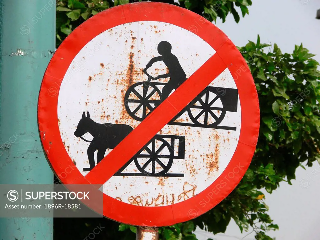 India. New Delhi. Road_sign banning horse_drawn carts and cycle_driven carts.