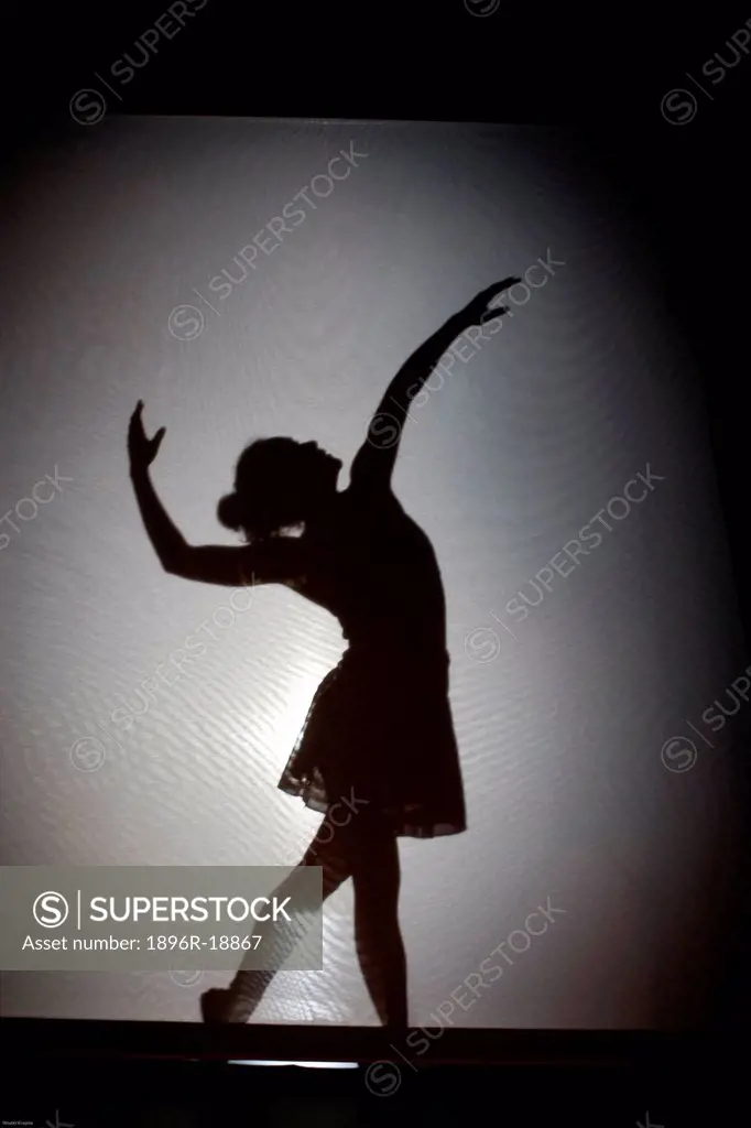 Studio shot of silhouette of ballerina dancing