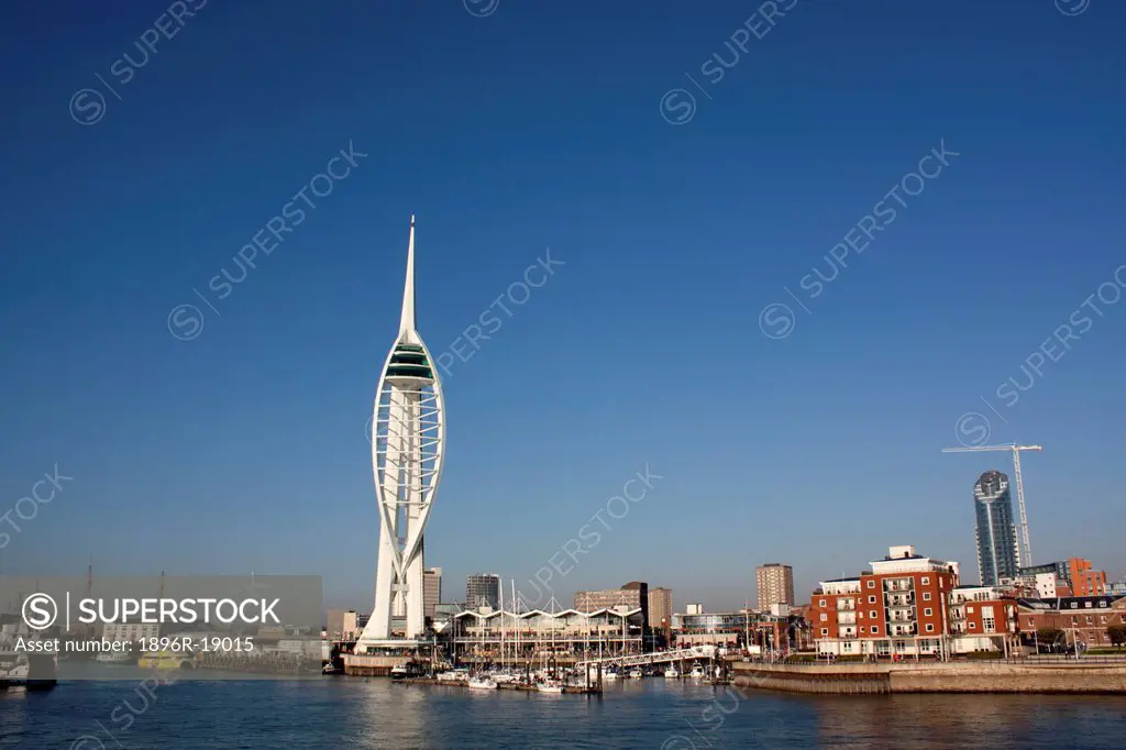 Sailing into Portsmouth Harbour, Hampshire, England. Spinnaker Tower dominates the skyline