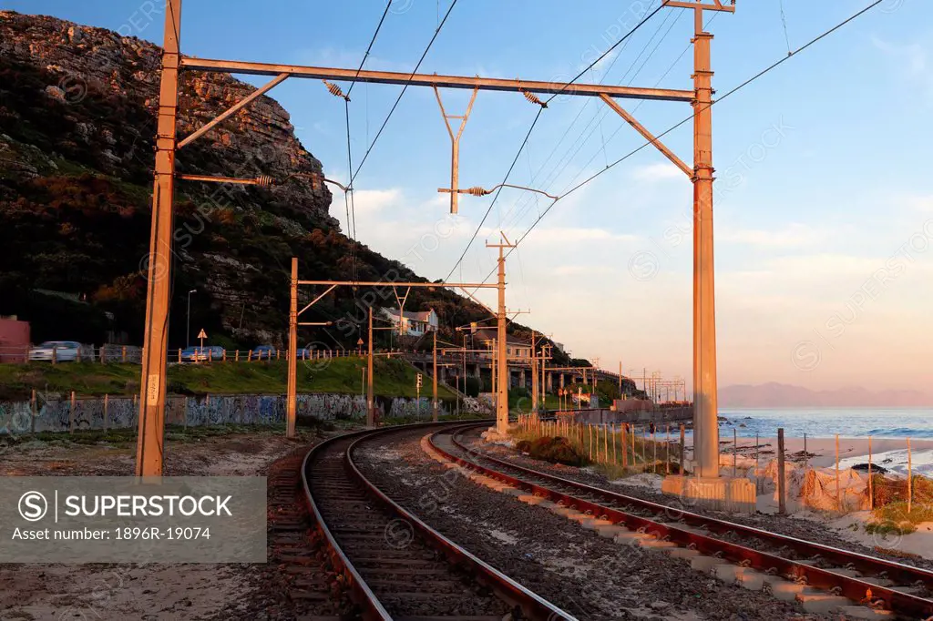 Wide angle view of the cape peninsula railway near Clovelly beach. Cape Peninsula, Western Cape, South Africa