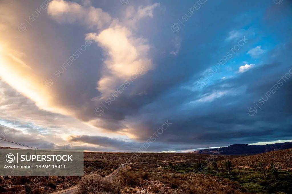 Puffy clouds over desert landscape, Clanwilliam, Western Cape Province, South Africa