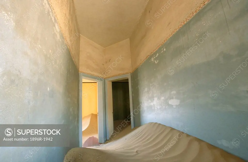 Two doors in a deserted house, half filled with sand, Kolmankop, Namibia