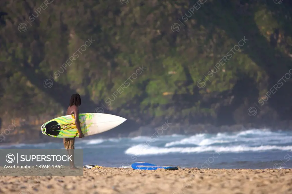 Surfer on the beach, Coffeebay, Transkei, Eastern Cape Province, South Africa
