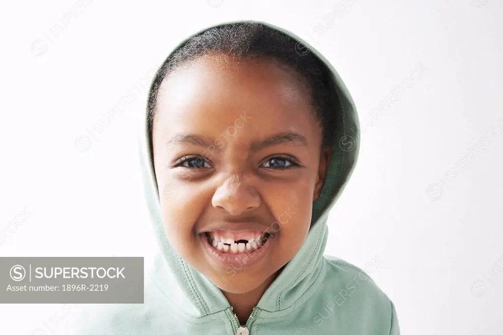Young girl showing missing tooth