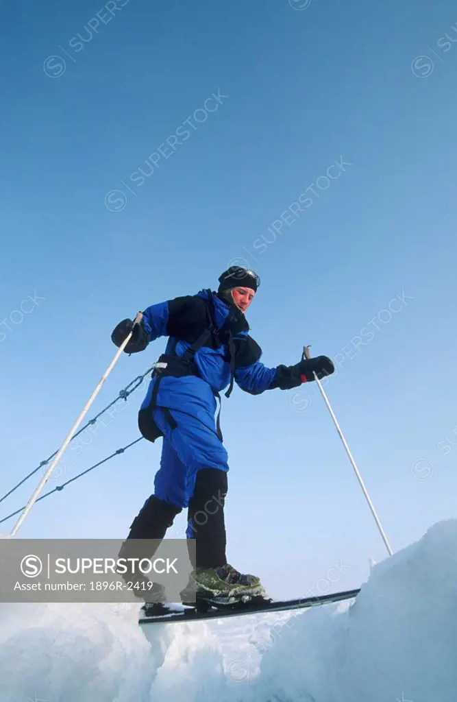 Skier Stepping Over a Crevasse - Low Angle View  North Pole, Arctic Ocean