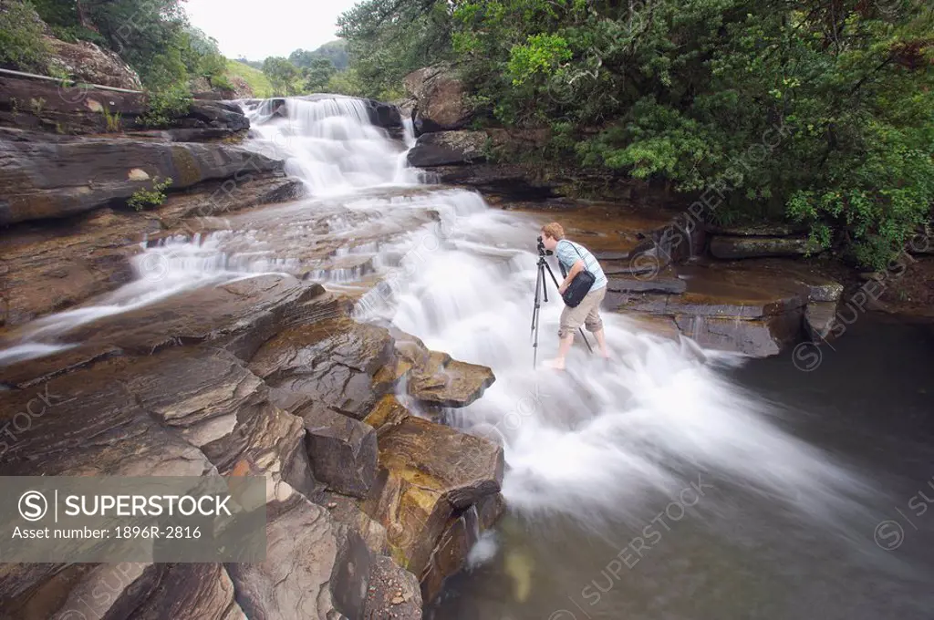 Man Photographing a Waterfall  Royal Natal National Park, Drakensberg Mountains, KwaZulu Natal Province, South Africa