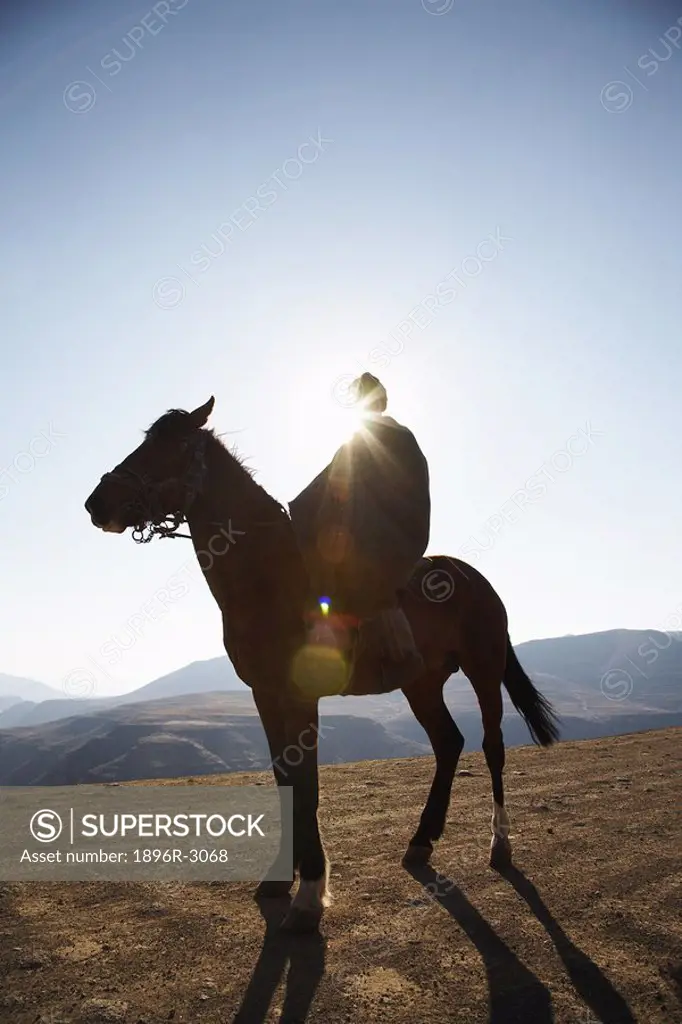 Man on Horse Silhouette by Sun  Lesotho, Southern Africa