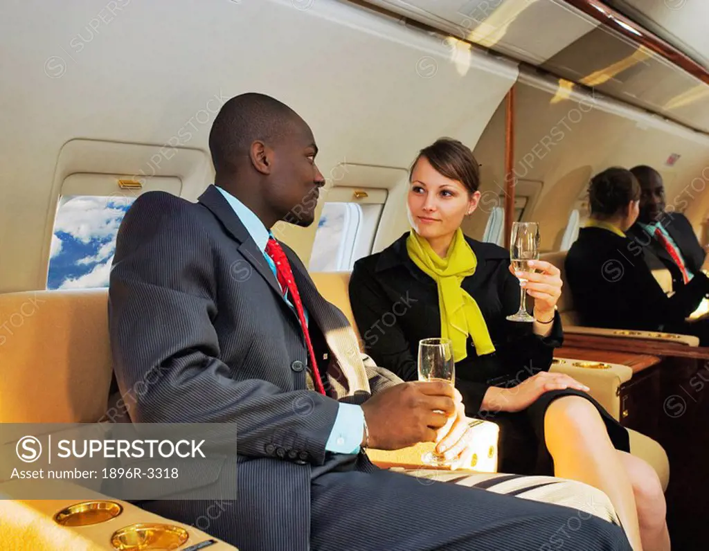 Business Partners Drinking a Toast in a Private Jet  Gauteng Province, South Africa