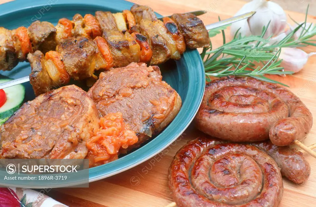 Mutton & Appricot Kebabs,Spiral Sausage on Skewer and Tomato Salsa Chops  Studio Shot