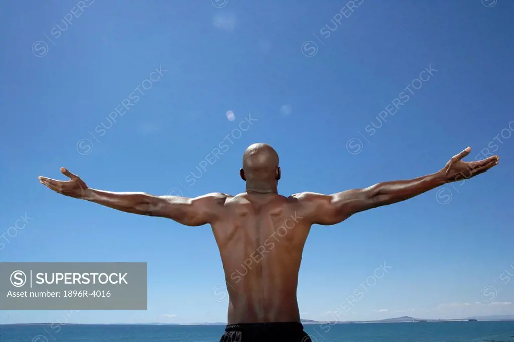 Rear View of Man With Arms Out  Cape Town, Western Cape Province, South Africa