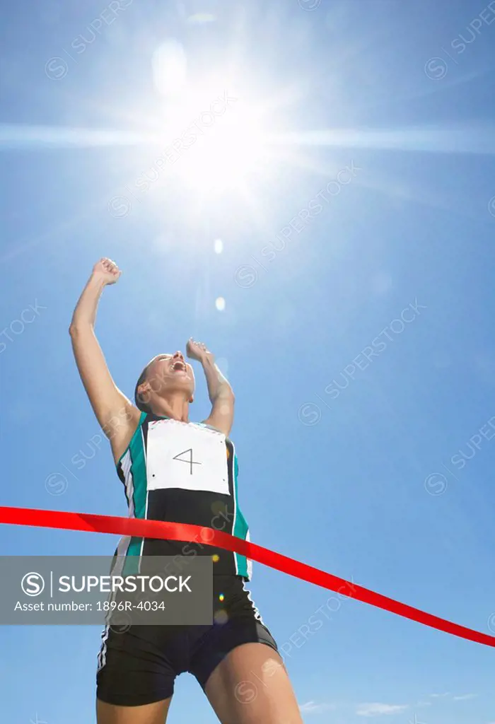 Low Angle View of Woman Finishing Race  Cape Town, Western Cape Province, South Africa