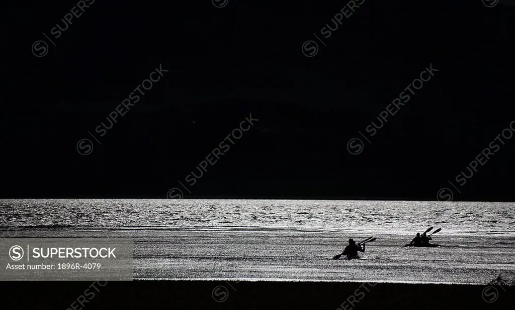 Silhouette of People in Kayaks in the Sea  East London, Eastern Cape Province, South Africa