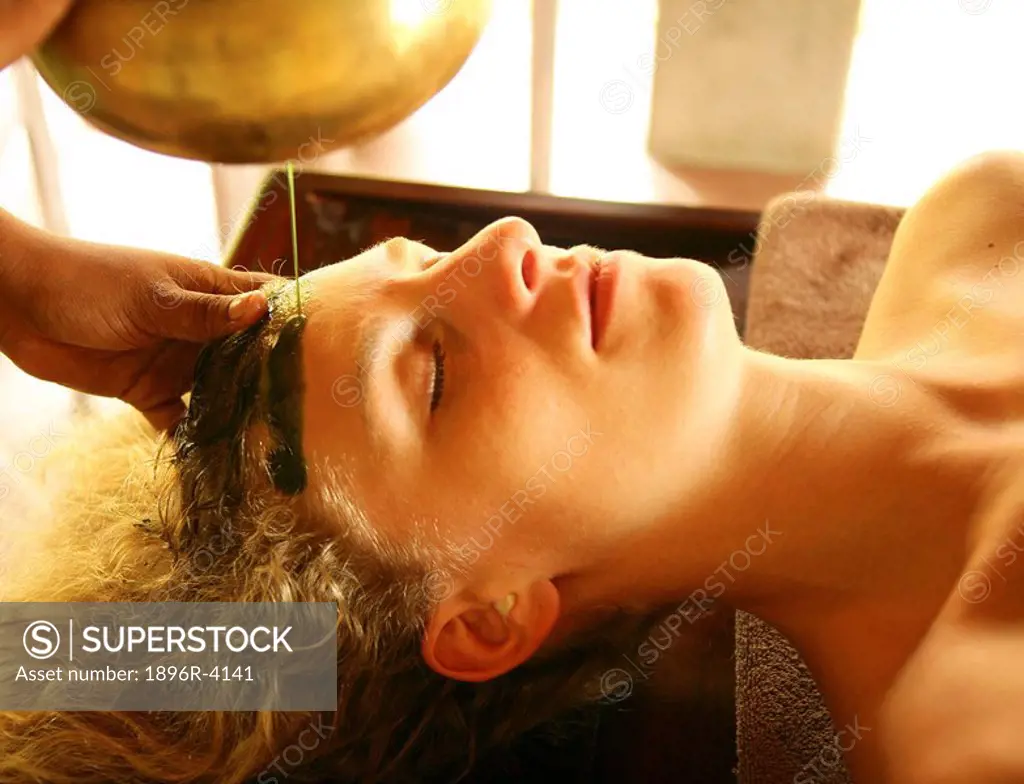 Woman in a Spa Receiving a Head Massage  Seychelles, Indian Ocean