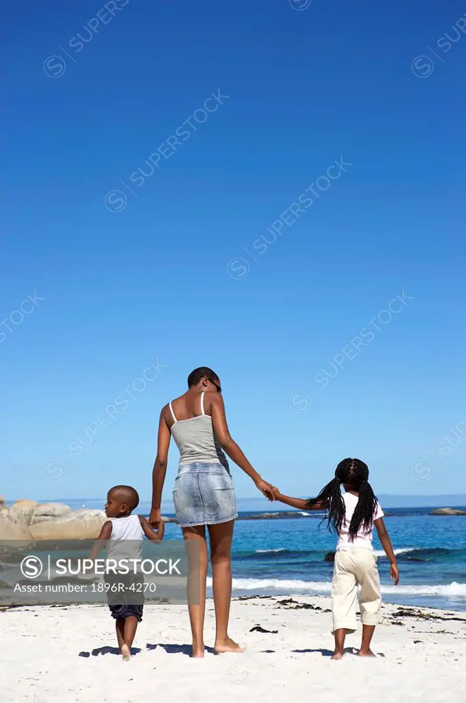 African Woman on the Beach with her Children  Cape Town, Western Cape Province, South Africa