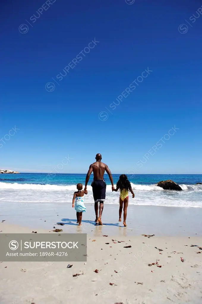 Afracan Man with his Children on the Beach  Cape Town, Western Cape Province, South Africa