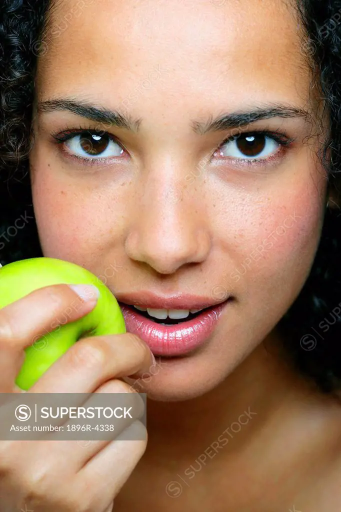 Portrait of an African Woman Holding a Fresh Apple  Cape Town, Western Cape Province, South Africa