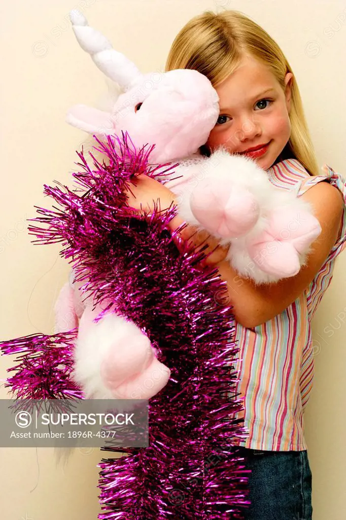 Portrait of a Young Girl Holding a Unicorn Teddy  Cape Town, Western Cape Province, South Africa