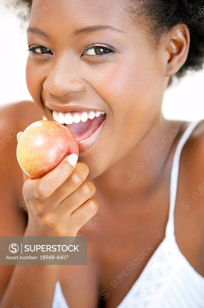 Portrait of an African Woman Holding a Fresh Apple  Cape Town, Western Cape Province, South Africa