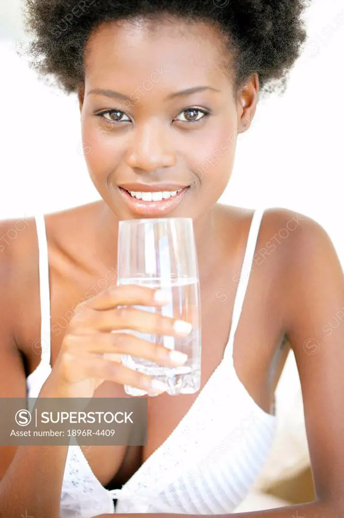 Portrait of an African Woman Holding a Glass of Water  Cape Town, Western Cape Province, South Africa