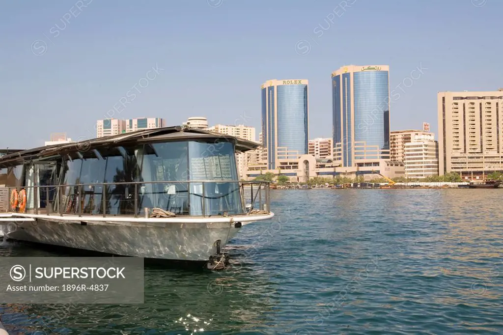 Tour boat and High rises such as Twin Towers Intercontinental Hotel  Deira Creek, United Arab Emirates