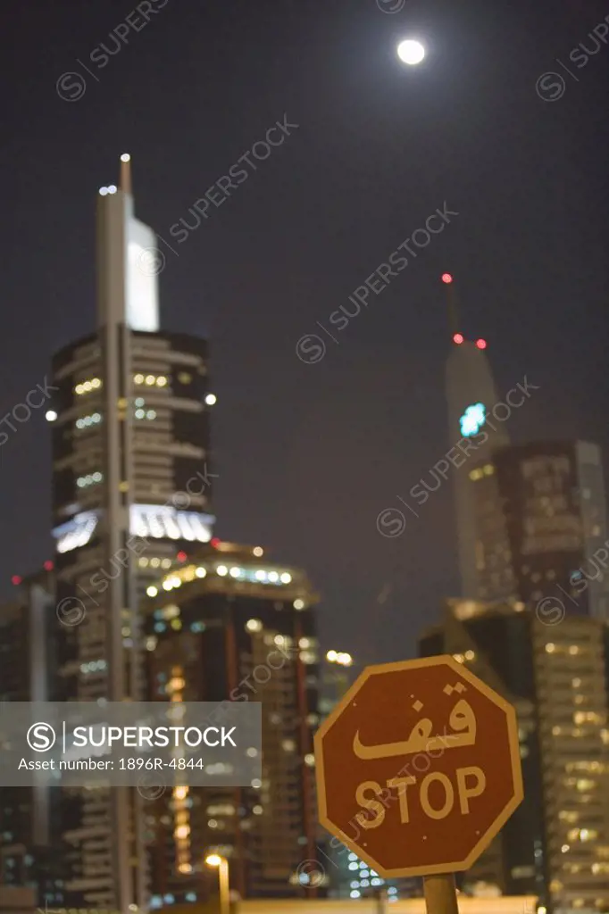 Stop Sign in front of High rise Buildings at Night on Sheikh Zayed Road  Dubai, United Arab Emirates