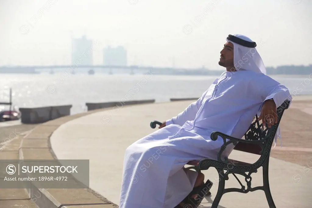Arab Man Sitting on Park Bench  Dubai, United Arab Emirates