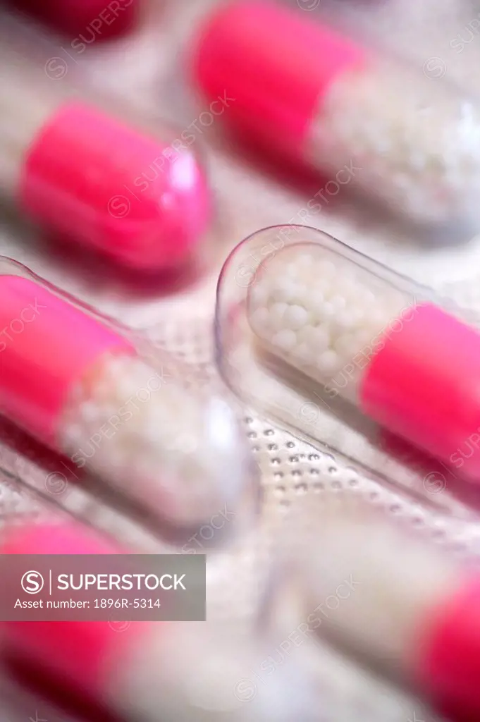 Extreme Close-up of a Sheet of Pink Pill Capsules  Studio Shot