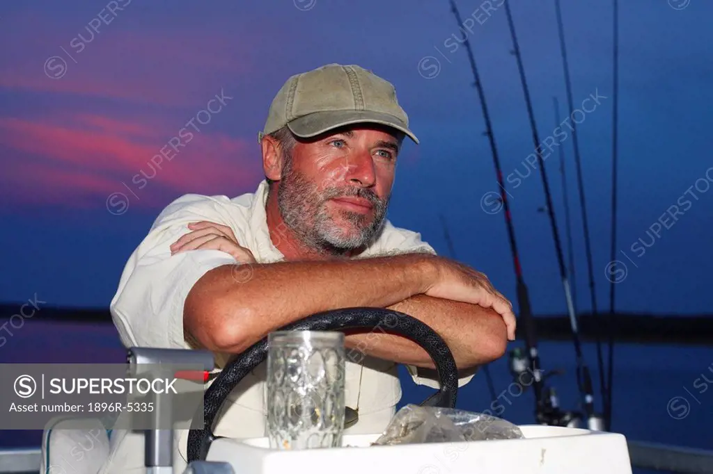 Middle Aged Man Sitting on a Boat on Lake Kariba  Lake Kariba, Zimbabwe