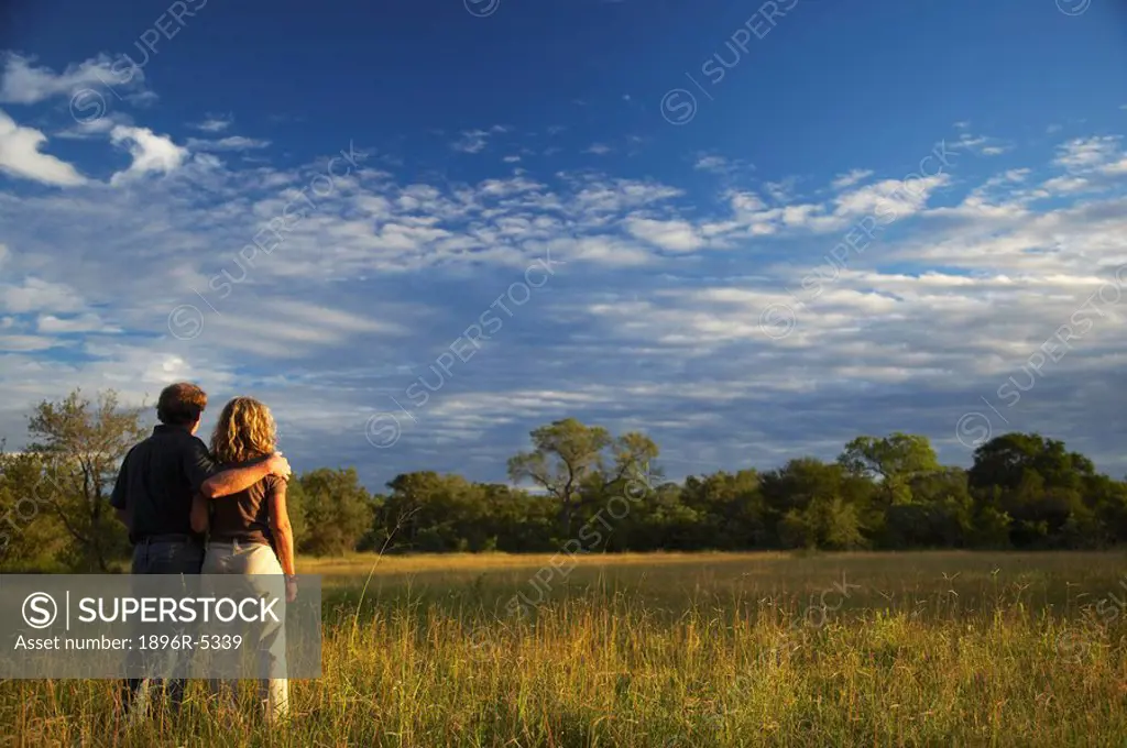 Couple in the Veld at Sunset  Kruger National Park, Mpumalanga Province, South Africa