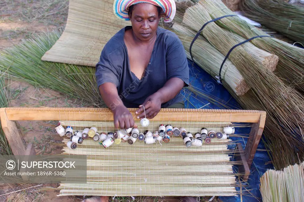 African Woman Weaving Mats  St Lucia Wetland Park, KwaZulu Natal Province, South Africa