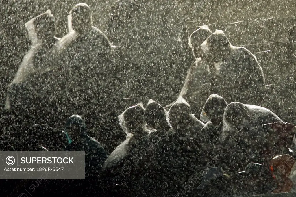Silhouette of Athletics Spectators Sitting in the Rain  Helsinki, Finland