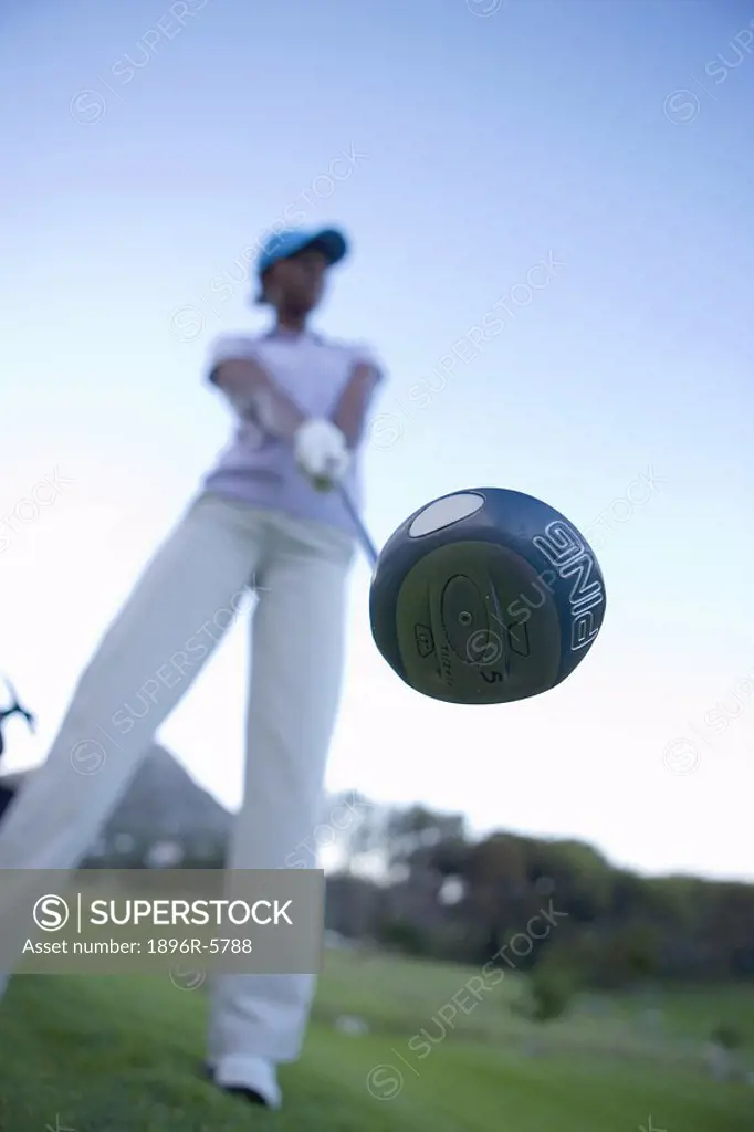 Low Angle View of Woman with Golf Club  Clovelly Golf Course, Cape Town, Western Province, South Africa