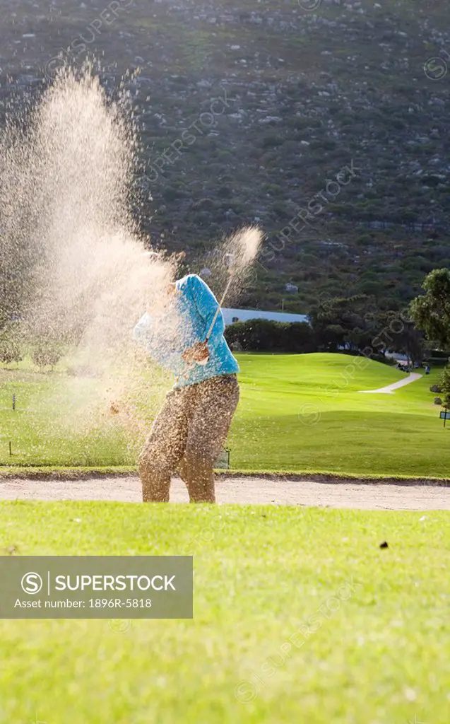 Man Hitting Golf Ball out of Bunker  Clovelly Golf Course, Cape Town, Western Province, South Africa