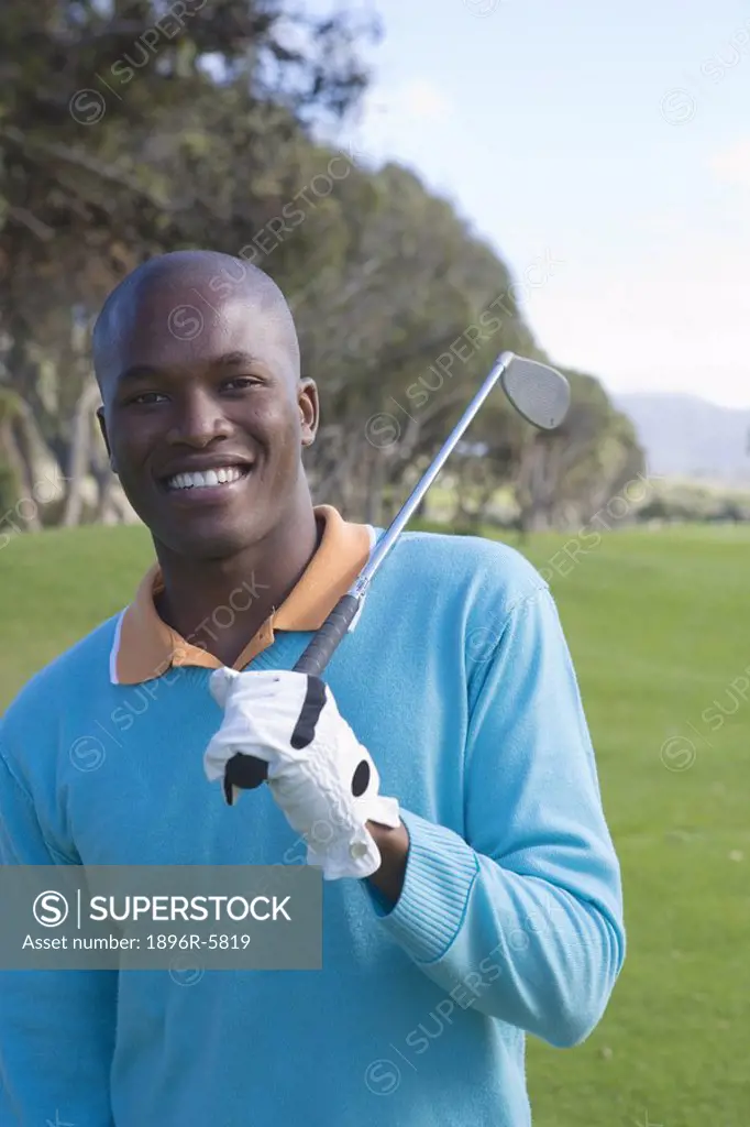 Portrait of Man Holding Golf Club  Clovelly Golf Course, Cape Town, Western Province, South Africa
